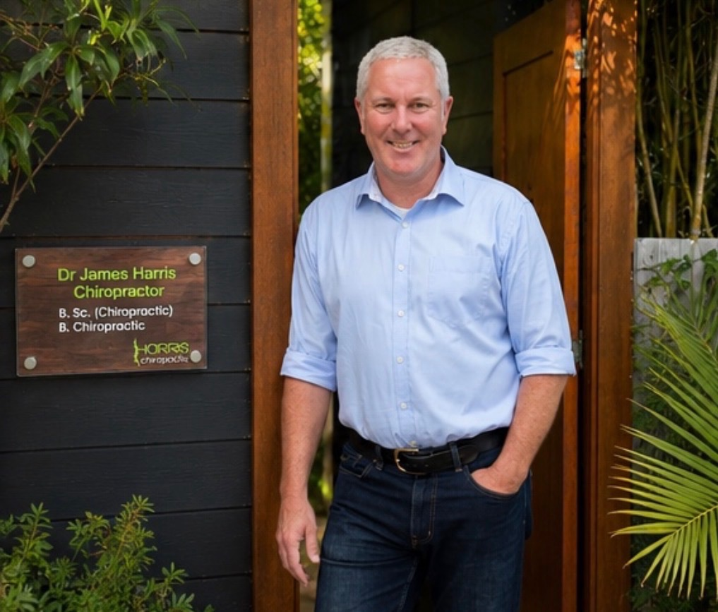 Dr James Harris standing at the entrance of Harris Chiropractic in Coffs Harbour.
